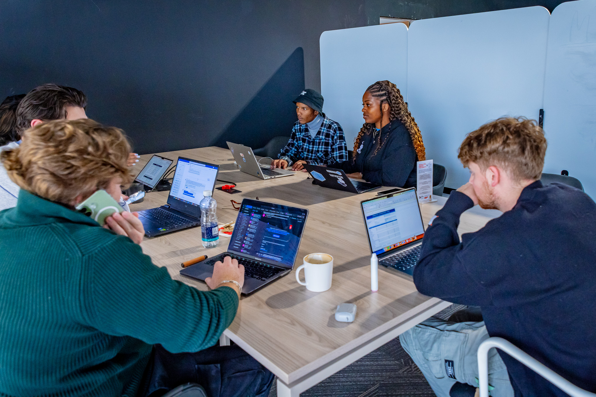 The BluShift team working together around a table